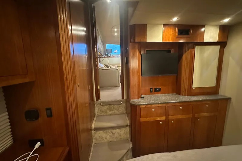 Sassy II Yacht Photos Pics Interior of 2008 Cruisers Yachts 415 Express Motoryacht with wood cabinetry and TV.