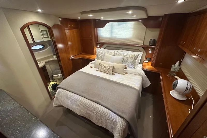 Sassy II Yacht Photos Pics Luxurious 2008 Cruisers Yachts 415 Express Motoryacht bedroom with elegant wood finishes.