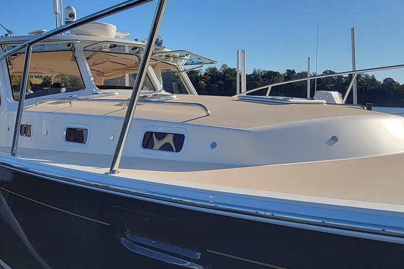 Captivator Yacht Photos Pics 2017 MJM 40z Downeast boat with sleek design and modern features on a sunny day.