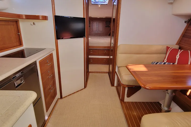Captivator Yacht Photos Pics Luxurious interior of 2017 MJM 40z Downeast yacht with modern kitchen and cozy seating area.