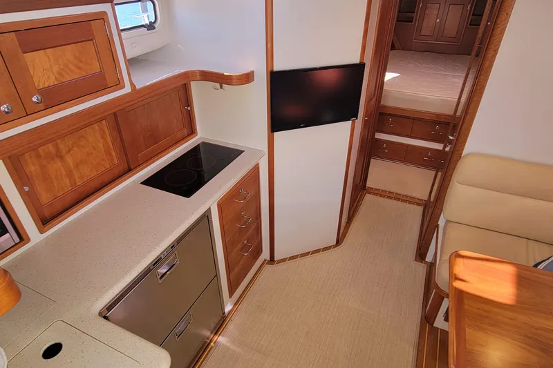 Captivator Yacht Photos Pics 2017 MJM 40z Downeast yacht interior with modern kitchen and cozy cabin.