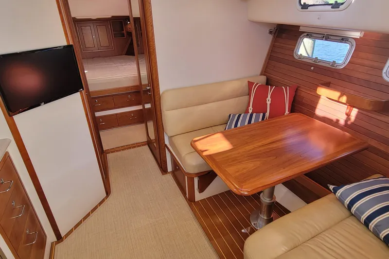 Captivator Yacht Photos Pics Luxurious 2017 MJM 40z Downeast yacht interior with cozy seating and elegant wood finishes.
