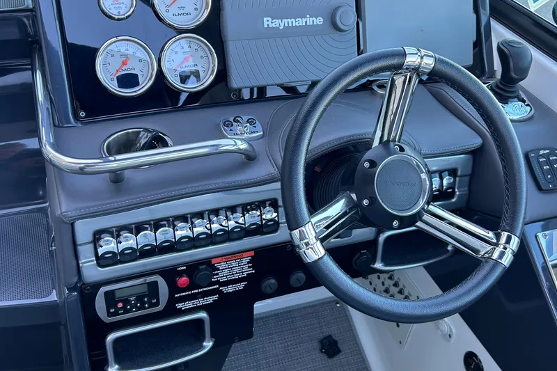  Yacht Photos Pics 2018 Formula 310 Sun Sport dashboard with steering wheel and gauges.