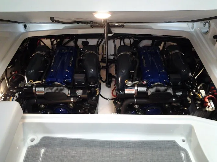 Yacht Photos Pics Engine compartment of a 2018 Formula 310 Sun Sport boat, showcasing dual powerful engines.