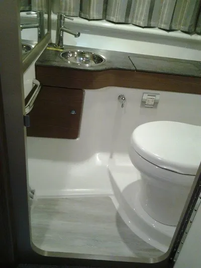  Yacht Photos Pics 2018 Formula 310 Sun Sport bathroom with modern fixtures and sleek design.