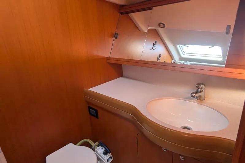  Yacht Photos Pics Bathroom interior of 2006 Grand Soleil 50 yacht with sink and mirror.