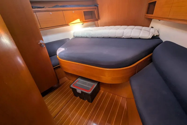  Yacht Photos Pics Luxurious cabin interior of 2006 Grand Soleil 50 yacht with wooden finishes.