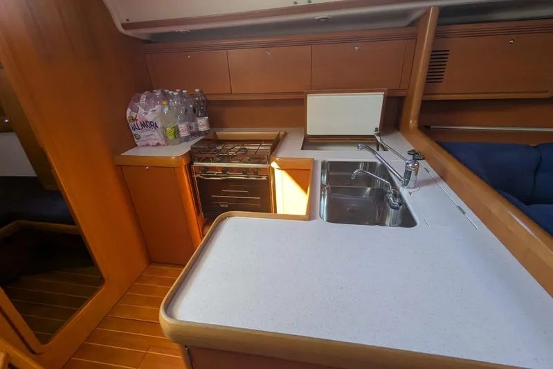  Yacht Photos Pics Interior of 2006 Grand Soleil 50 yacht kitchen with stove, sink, and storage.