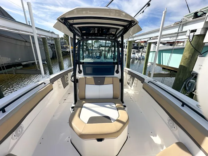  Yacht Photos Pics 2017 Wellcraft 302 Fisherman boat interior with seating and console, docked at marina.