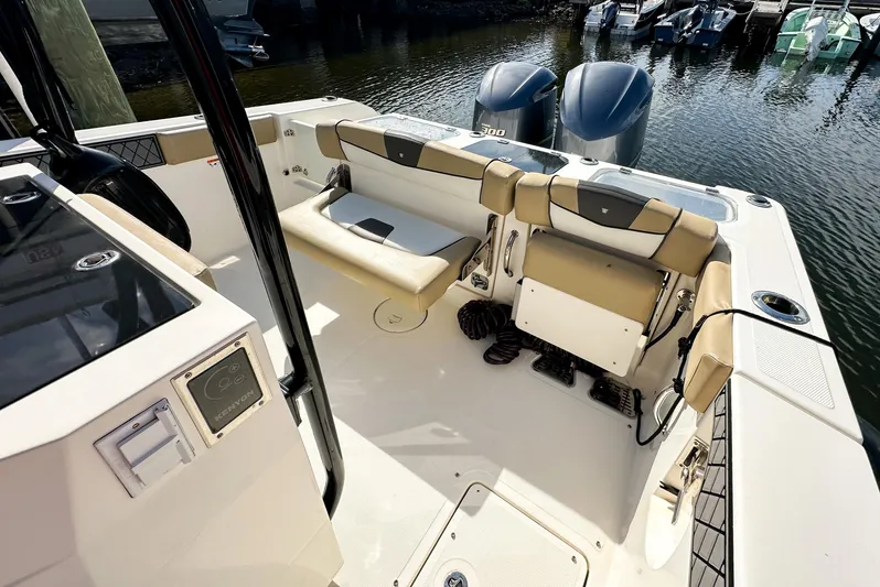  Yacht Photos Pics 2017 Wellcraft 302 Fisherman boat interior with seating and twin outboard motors.