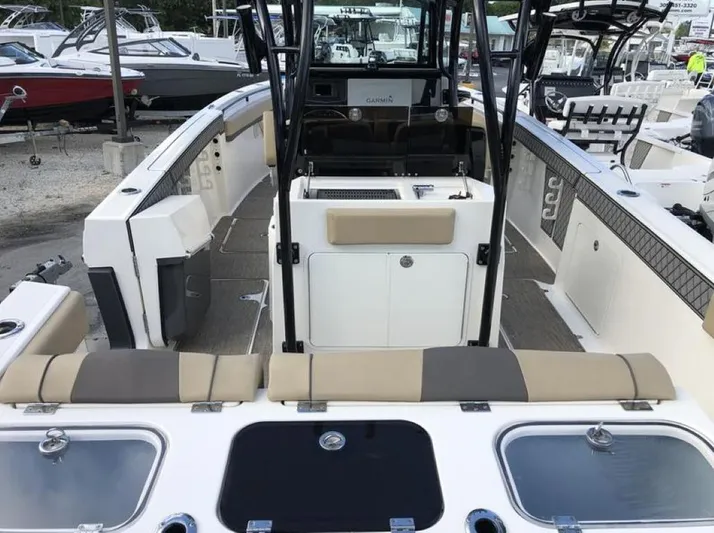  Yacht Photos Pics 2018 Wellcraft 302 Fisherman boat interior with seating and storage compartments.