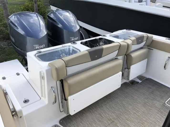  Yacht Photos Pics 2018 Wellcraft 302 Fisherman boat with dual Yamaha 300 engines and cushioned seating.