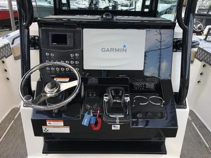  Yacht Photos Pics 2018 Wellcraft 302 Fisherman helm with Garmin navigation system and controls.