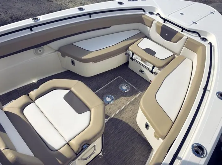  Yacht Photos Pics Interior seating of 2018 Wellcraft 302 Fisherman boat, featuring beige and white cushioned seats.
