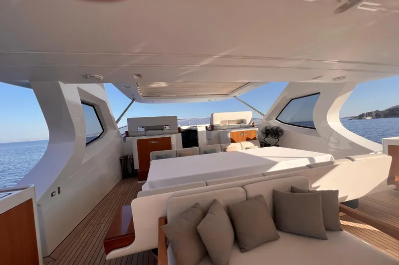 Dagusha Yacht Photos Pics Luxurious Azimut Grande 35 Metri yacht interior, 2020 model, with elegant seating and ocean view.