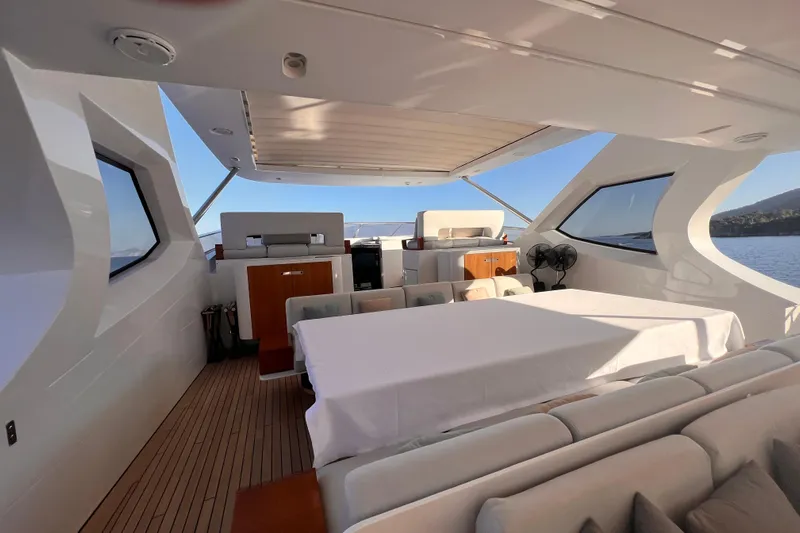 Dagusha Yacht Photos Pics Luxurious Azimut Grande 35 Metri yacht interior, featuring elegant seating and panoramic windows.