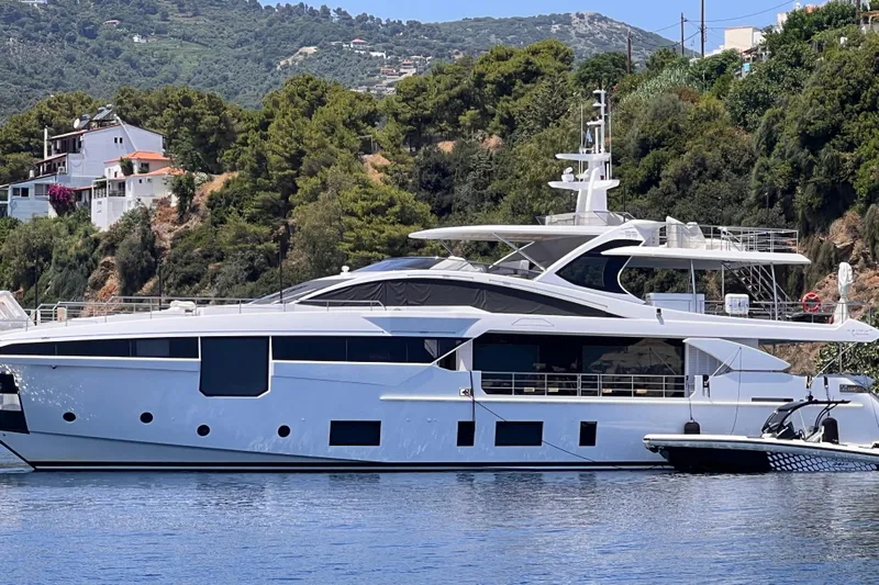 Dagusha Yacht Photos Pics Luxurious 2020 Azimut Grande 35 Metri yacht docked by scenic hillside.