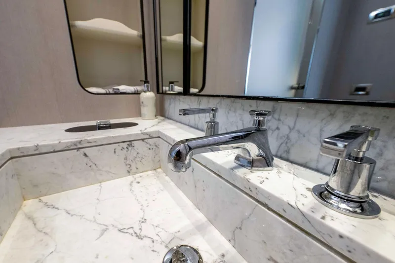 Dagusha Yacht Photos Pics Luxurious marble bathroom sink with chrome fixtures on Azimut Grande 35 Metri yacht, 2020 model.