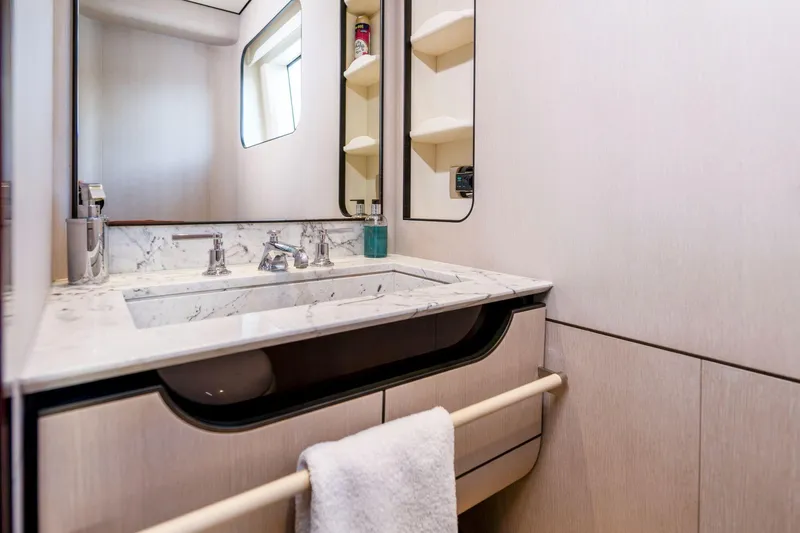 Dagusha Yacht Photos Pics Luxurious bathroom in 2020 Azimut Grande 35 Metri yacht with marble sink and modern fixtures.