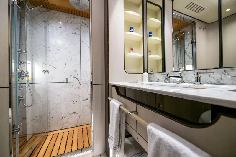 Dagusha Yacht Photos Pics Luxurious bathroom in 2020 Azimut Grande 35 Metri yacht with marble and wood accents.