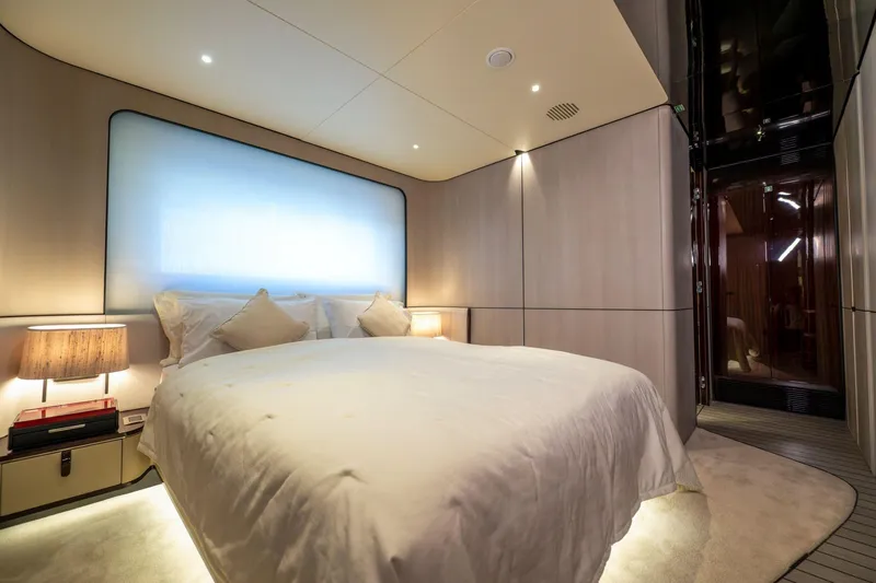 Dagusha Yacht Photos Pics Luxurious bedroom interior on 2020 Azimut Grande 35 Metri yacht, featuring elegant lighting and modern design.