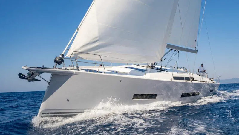  Yacht Photos Pics 2025 Hanse 410 yacht sailing on open sea under clear blue sky.