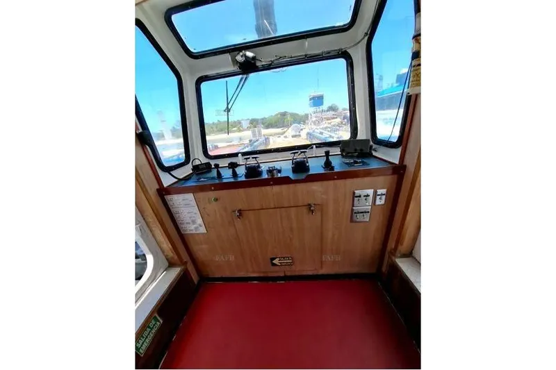  Yacht Photos Pics Interior view of a custom 2008 control cabin with panoramic windows and control panel.