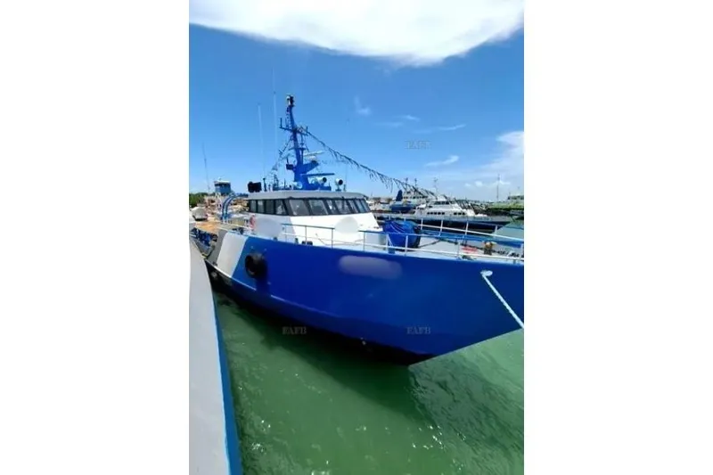  Yacht Photos Pics Blue custom boat docked in harbor, clear sky, 2008 model.