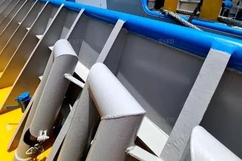  Yacht Photos Pics Close-up of a custom 2008 boat deck with blue and yellow accents.