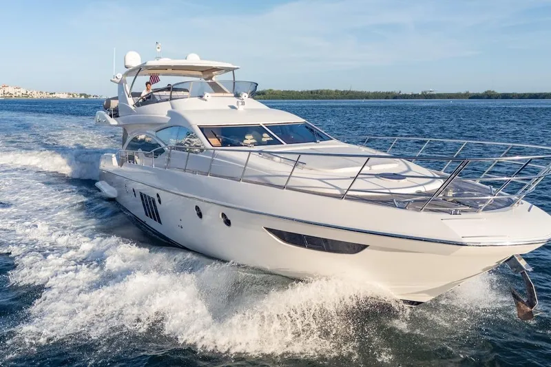 Drakkar Yacht Photos Pics Luxurious 2012 Azimut Evolution yacht cruising on open water.