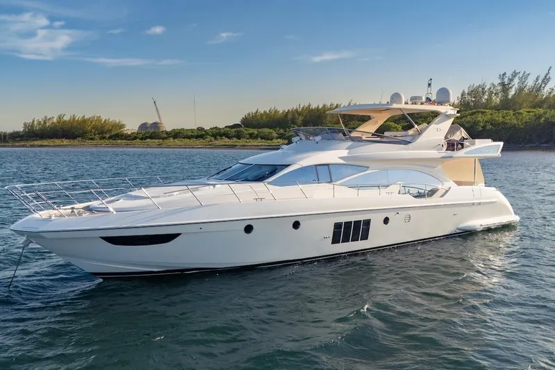 Drakkar Yacht Photos Pics Luxurious 2012 Azimut Evolution yacht cruising on serene waters.
