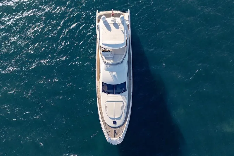 Drakkar Yacht Photos Pics Aerial view of 2012 Azimut Evolution yacht cruising on blue ocean waters.