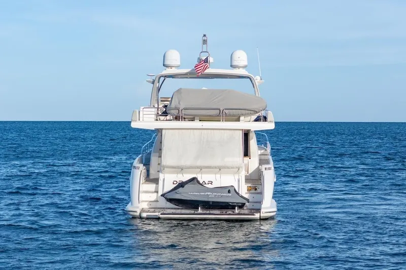 Drakkar Yacht Photos Pics 2012 Azimut Evolution yacht on open sea, rear view with jet ski.