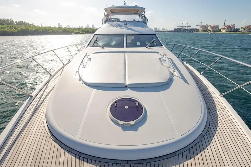Drakkar Yacht Photos Pics Luxurious 2012 Azimut Evolution yacht cruising on a sunny day, showcasing sleek design.