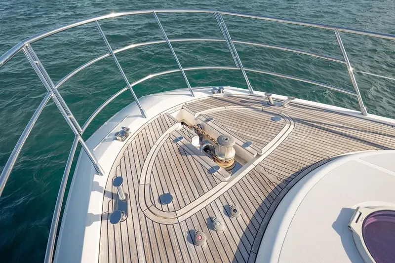 Drakkar Yacht Photos Pics Bow of 2012 Azimut Evolution yacht with teak deck and stainless steel railings.