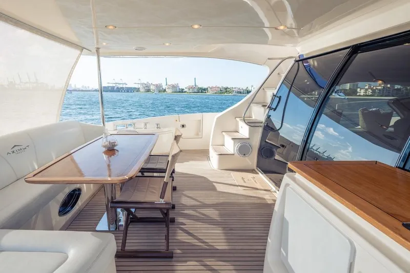 Drakkar Yacht Photos Pics Luxurious 2012 Azimut Evolution yacht interior with elegant seating and ocean view.