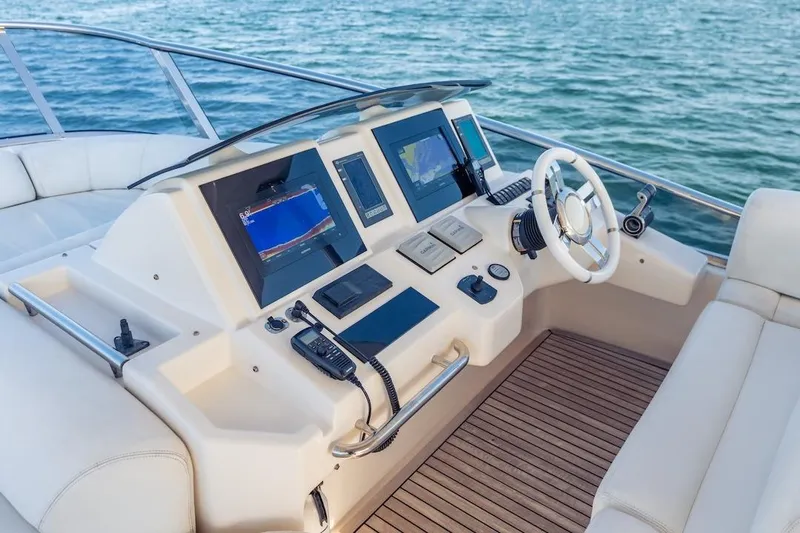 Drakkar Yacht Photos Pics Helm of 2012 Azimut Evolution yacht with navigation screens and steering wheel.