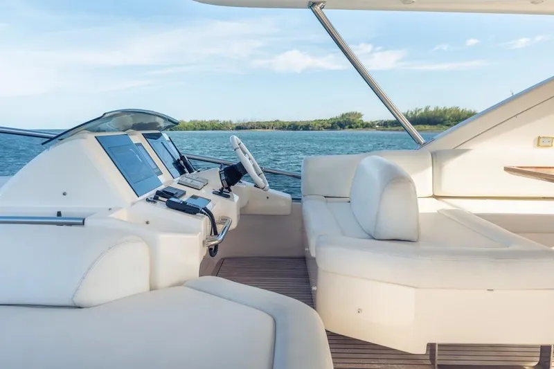 Drakkar Yacht Photos Pics Luxurious 2012 Azimut Evolution yacht interior with modern helm and plush seating.