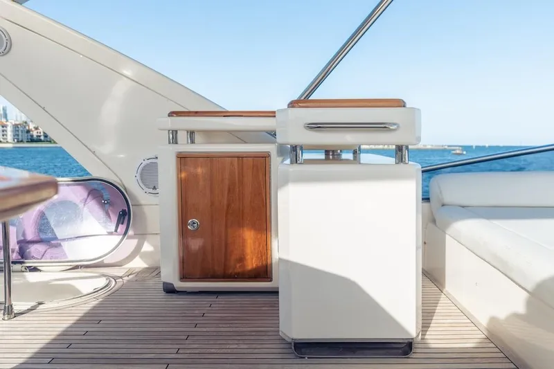 Drakkar Yacht Photos Pics Luxurious 2012 Azimut Evolution yacht interior with wooden cabinetry and ocean view.