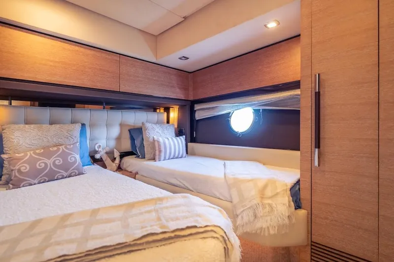Drakkar Yacht Photos Pics Luxurious 2012 Azimut Evolution yacht cabin with twin beds and elegant decor.