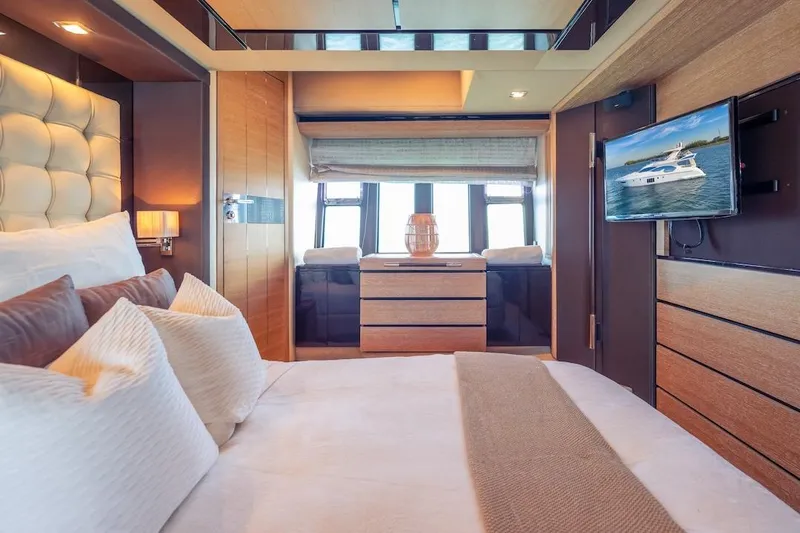 Drakkar Yacht Photos Pics Luxurious bedroom interior of 2012 Azimut Evolution yacht with modern decor and TV.