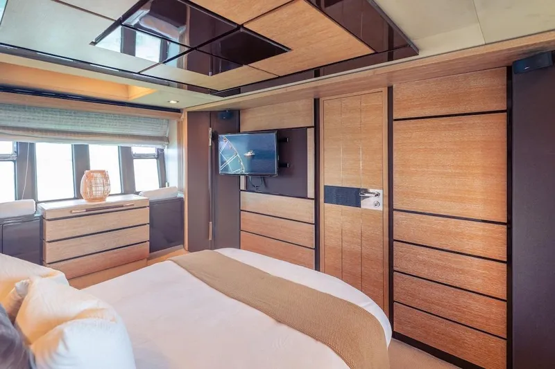 Drakkar Yacht Photos Pics Luxurious interior of 2012 Azimut Evolution yacht with modern wood paneling and elegant decor.