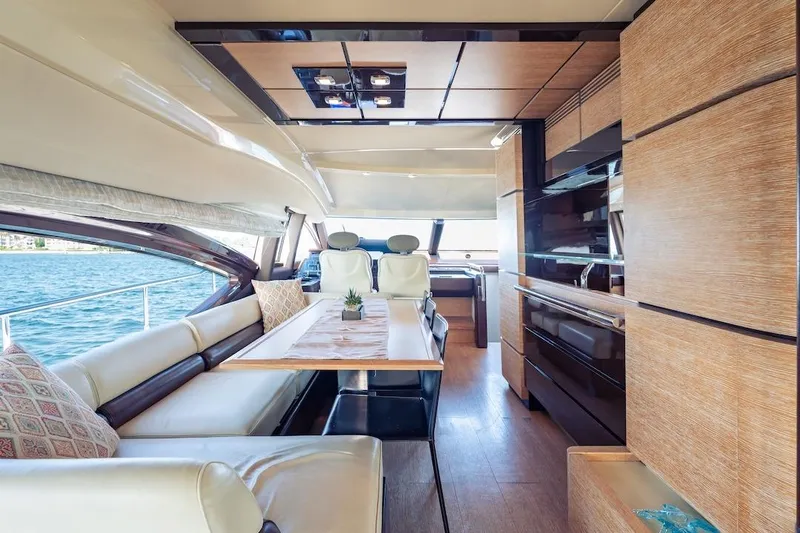 Drakkar Yacht Photos Pics Luxurious interior of 2012 Azimut Evolution yacht with elegant seating and dining area.
