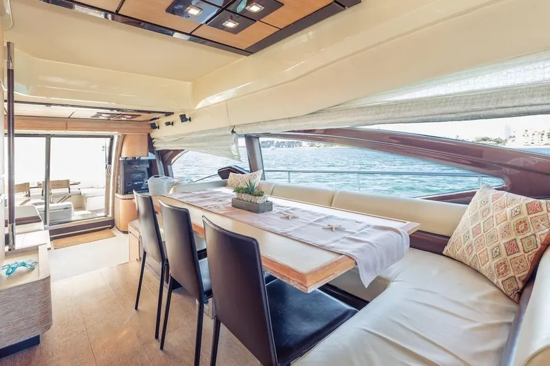 Drakkar Yacht Photos Pics Luxurious interior of 2012 Azimut Evolution yacht with elegant dining area and scenic ocean view.