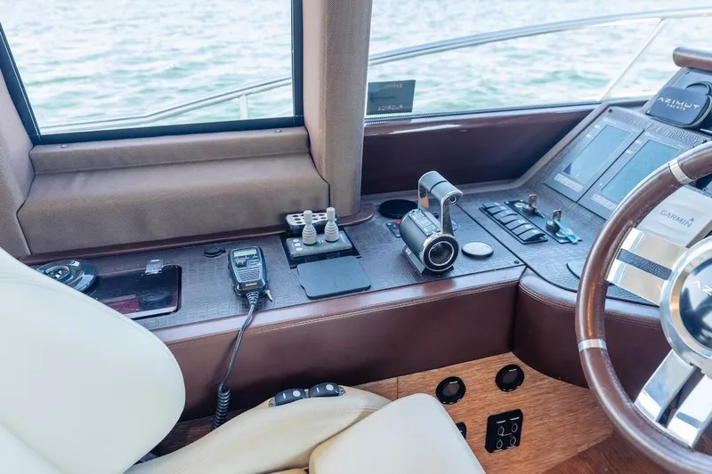Drakkar Yacht Photos Pics Helm of 2012 Azimut Evolution yacht with navigation controls and steering wheel.