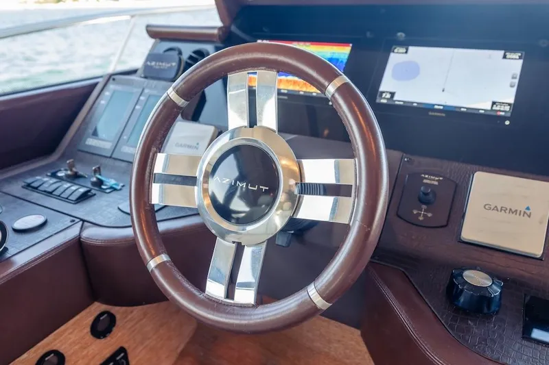 Drakkar Yacht Photos Pics Steering wheel of 2012 Azimut Evolution yacht with Garmin navigation system.