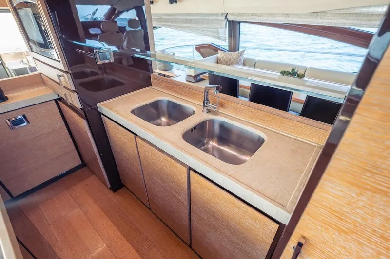 Drakkar Yacht Photos Pics Luxurious 2012 Azimut Evolution yacht kitchen with dual sinks and modern design.
