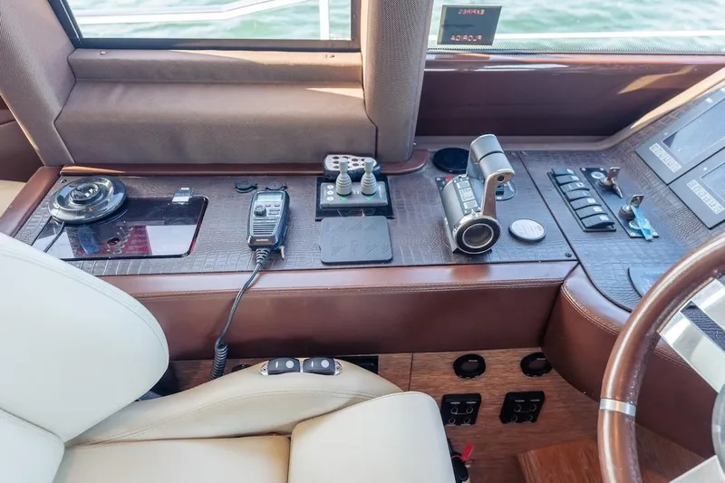 Drakkar Yacht Photos Pics Cockpit controls of a 2012 Azimut Evolution yacht, featuring navigation and communication equipment.