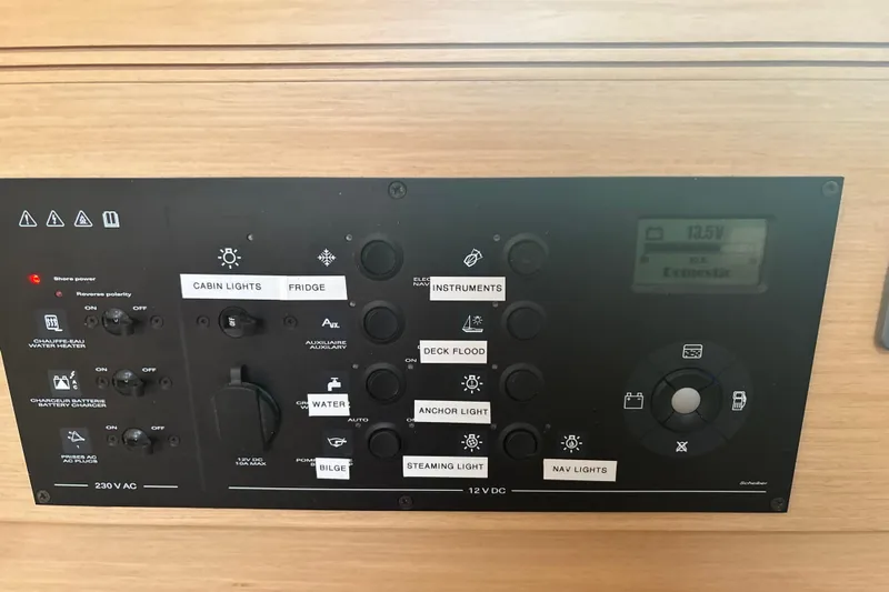 Statira Yacht Photos Pics Control panel of a 2017 Jeanneau Sun Odyssey 389 sailboat, featuring various switches and indicators.