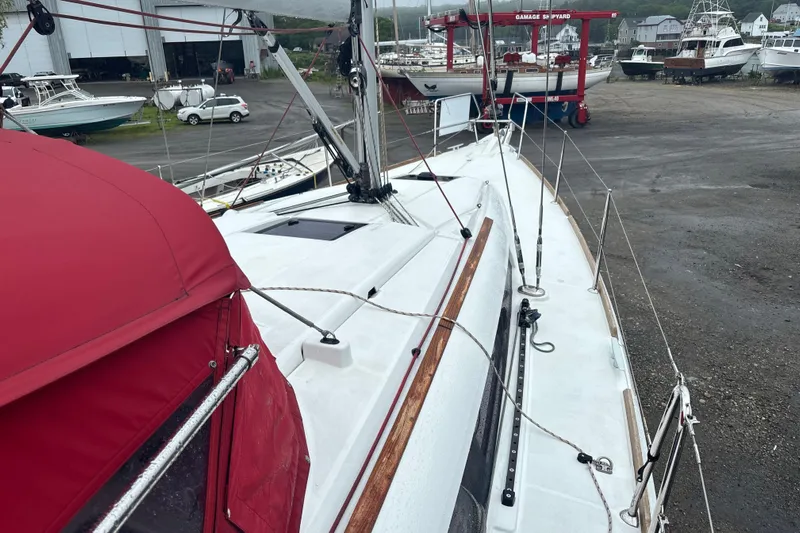 Statira Yacht Photos Pics 2017 Jeanneau Sun Odyssey 389 sailboat on land at a shipyard.